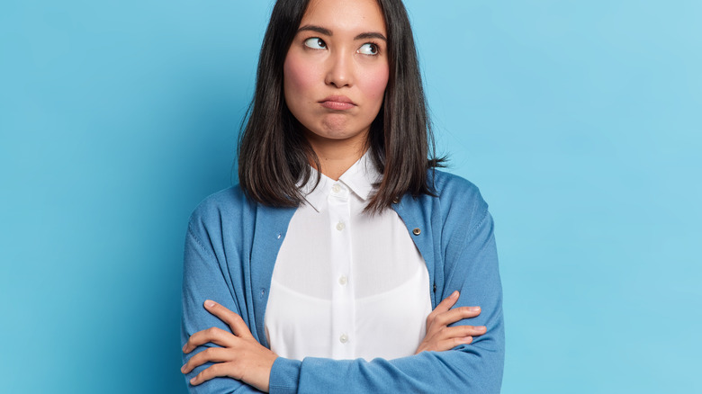 Irritated woman with crossed arms