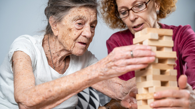 caregiver playing game with patient