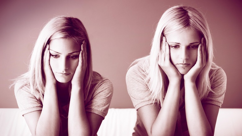 twin girls simultaneously experiencing sadness