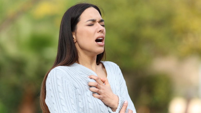 a woman struggles to breath asthma 
