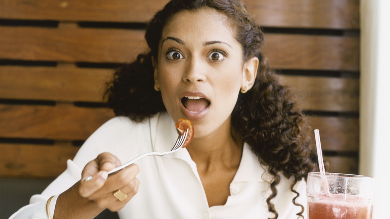 surprised woman eating