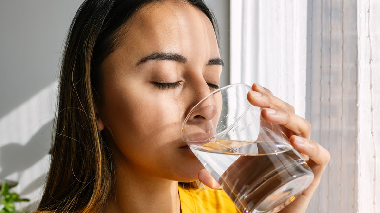 young person drinking water