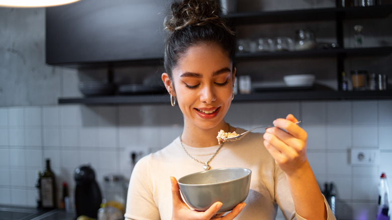 woman eating a lowfat snack in the evening