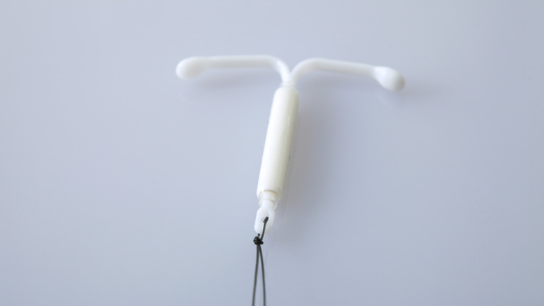 White IUD on a gray background 