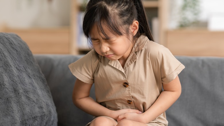 Child clutching stomach