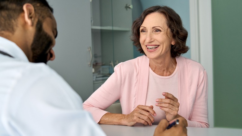 Happy patient smiling at doctor