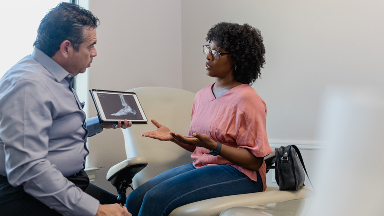 Patient speaking to podiatrist