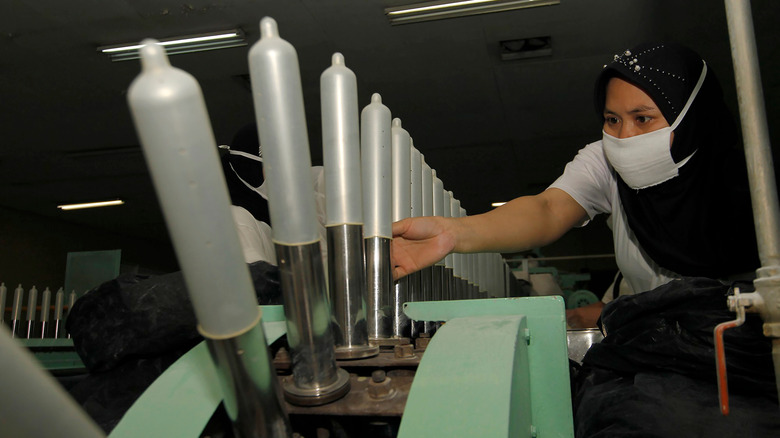 Condoms being manufactured in factory