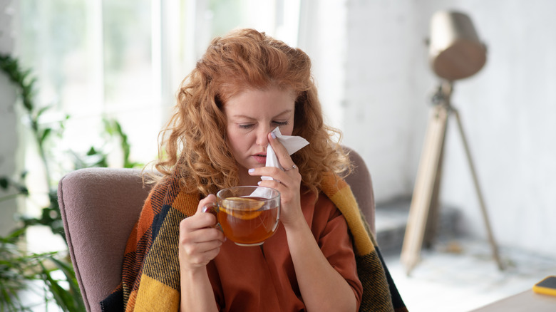 A woman with a cold drinks tea