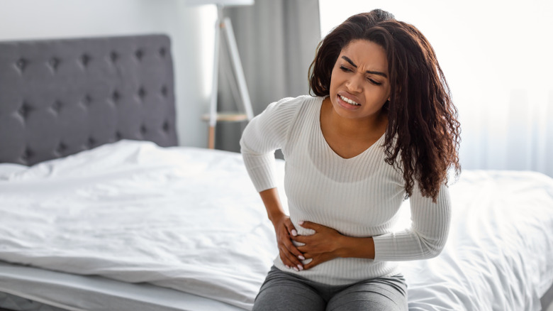 A woman has lower stomach pain