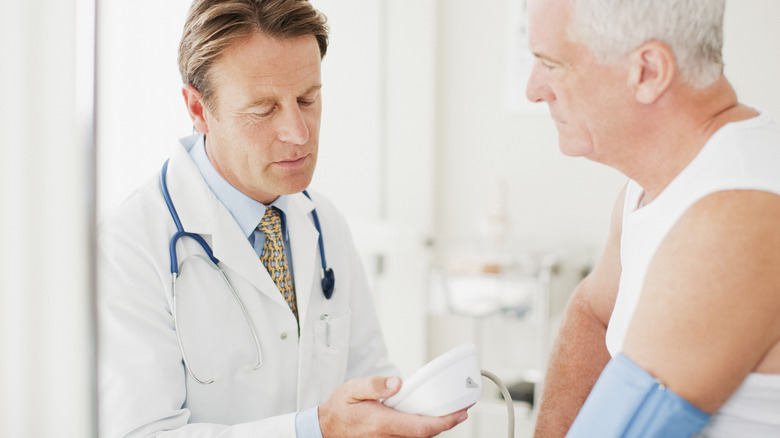 Man having blood pressure checked