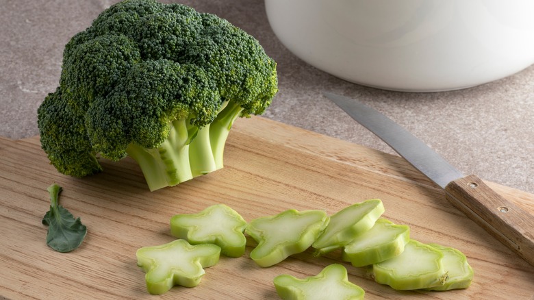 chopped broccoli on wooden block