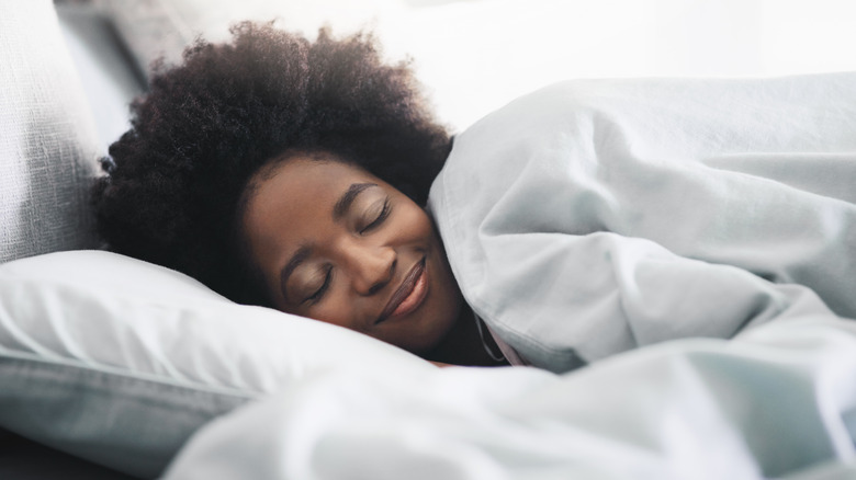 Smiling sleeping woman