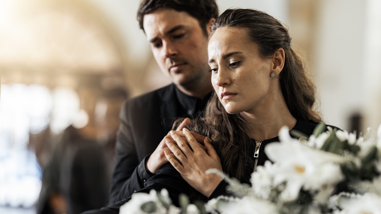 Couple sad at funeral