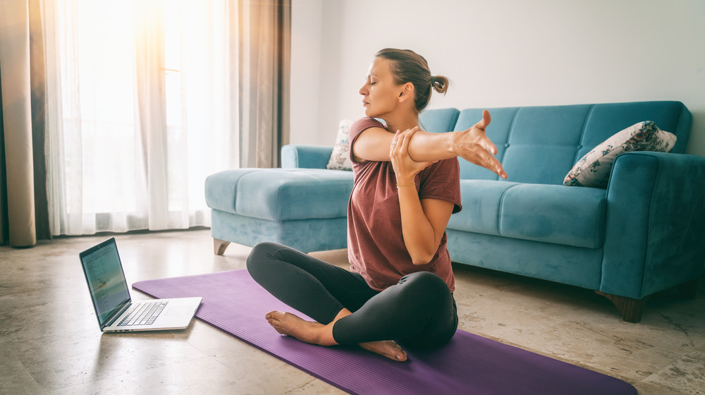 woman doing yoga at home