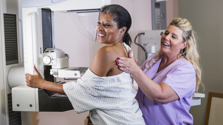 Patient receiving mammogram scan