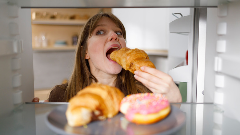 Woman eating a croissant 