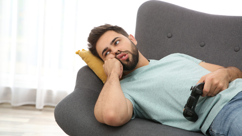 man lying on couch