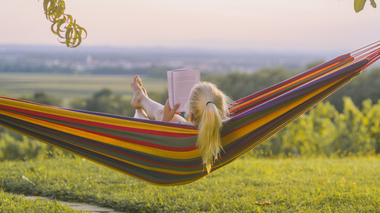 Woman reading in a hammock