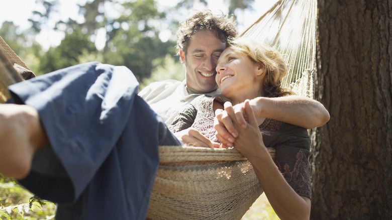 Smiling couple in hammock