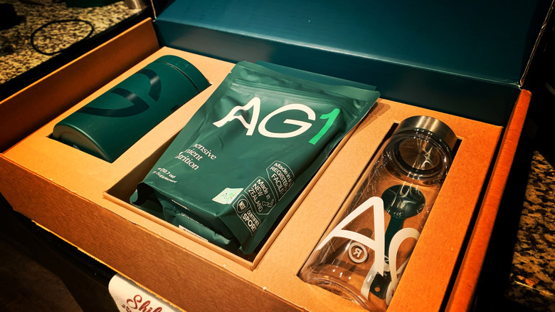 AG1 welcome kit with pouch, canister, and bottle