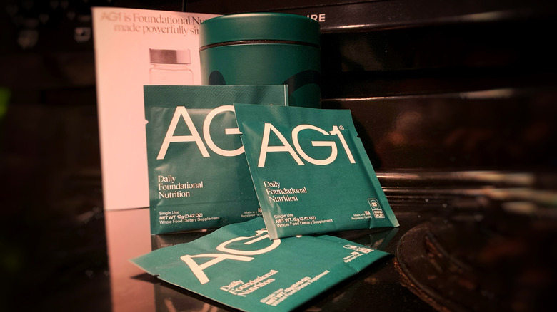 AG1 packets on a black background