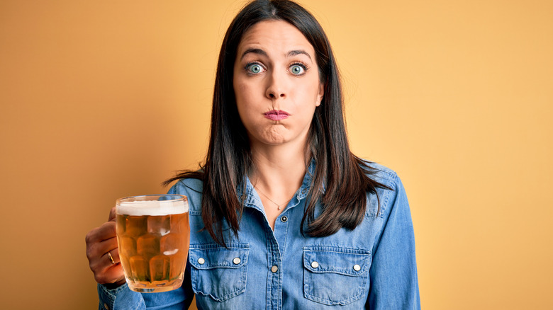 woman holding a beer