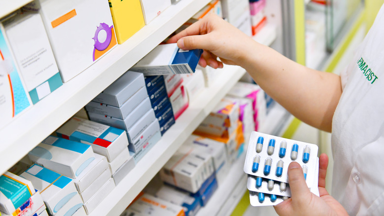 A pharmacist holds birth control pills