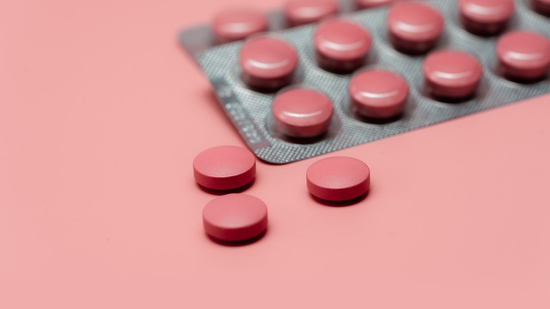 a package of tiny pink pills 