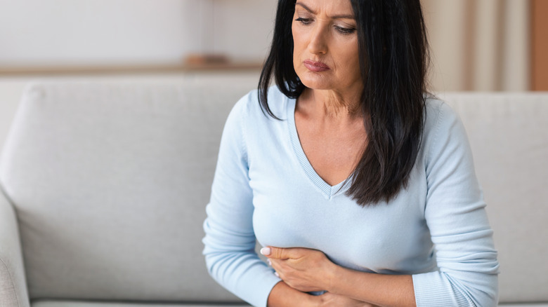 Woman holding her stomach