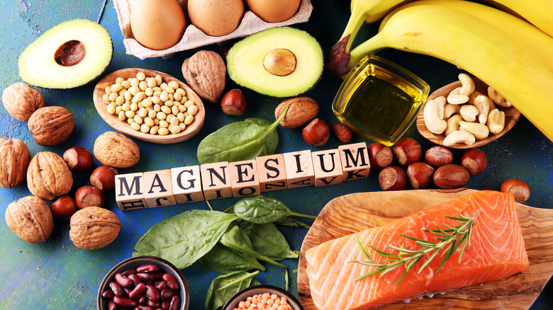 a display of magnesium packed foods like eggs, fish, nuts, avocado