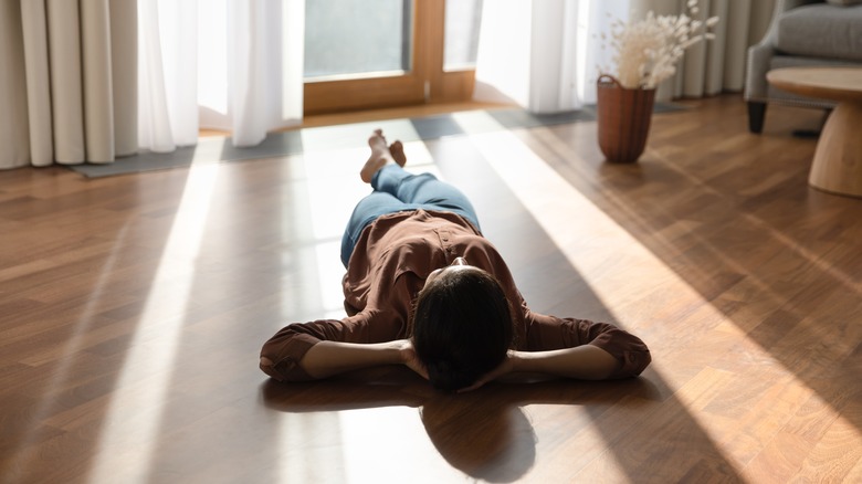 Woman sleeping on the floor