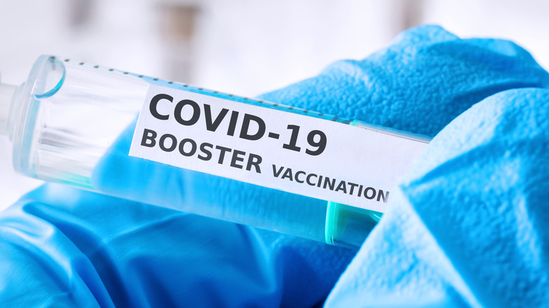 Needle and vial of COVID-19 vaccine 