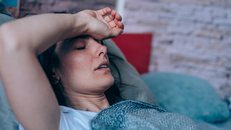 Woman in bed with cold