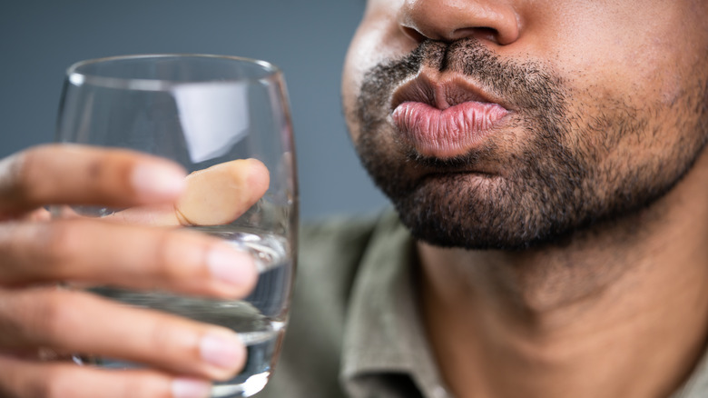 Man rinsing mouth 