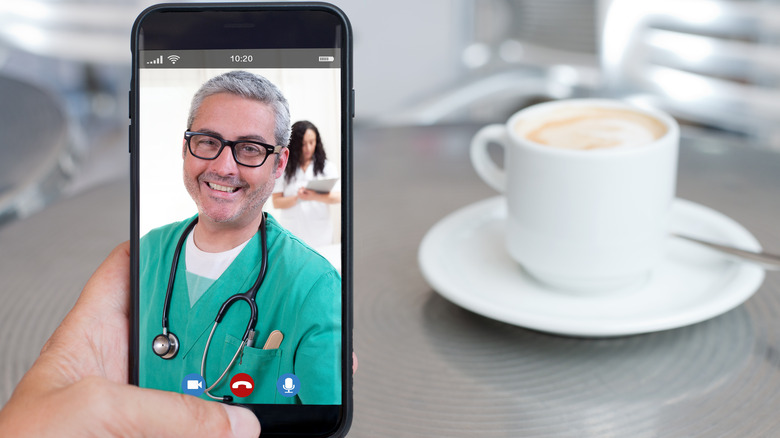 Video call with a doctor and coffee in the background 