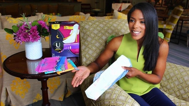 Dr. Jessica Shepherd demonstrating use of menstrual products