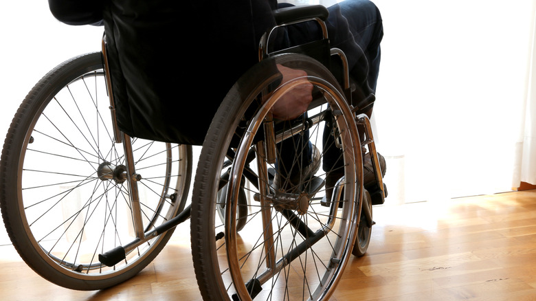 Shot of back of person sitting on wheelchair