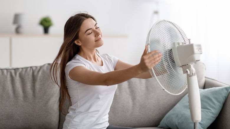 Woman using fan