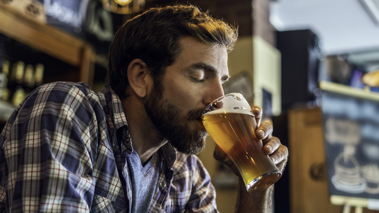 man drinking a beer