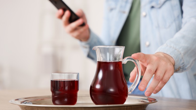 Man with red juice