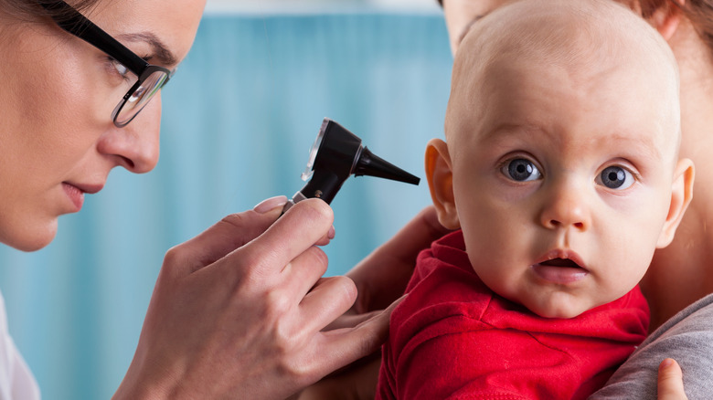 Baby getting ear exam