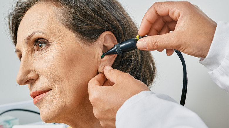 Older woman getting an ear test