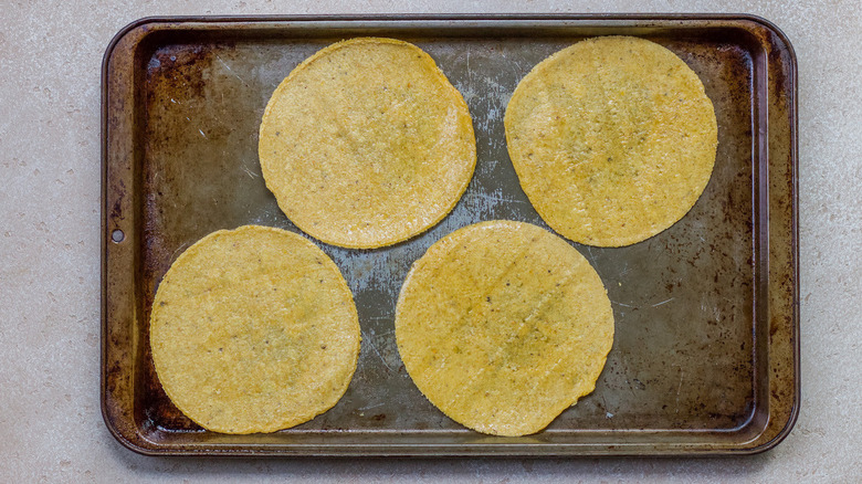 corn tortillas on a baking sheet