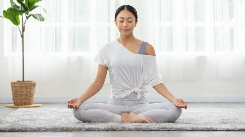 woman practicing yoga