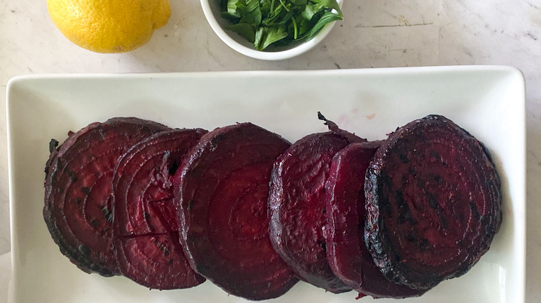 plating and seasoning grilled beets