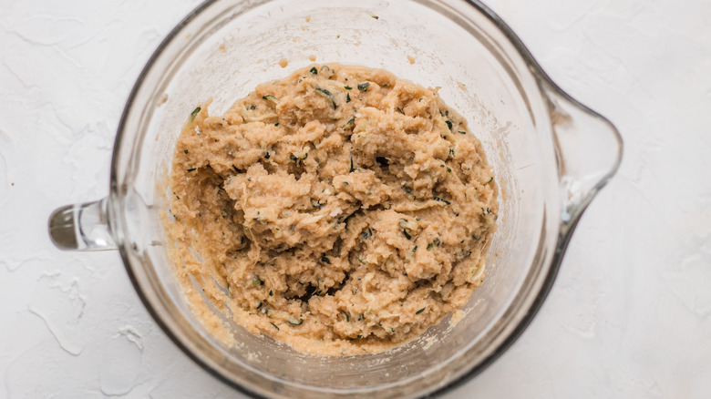 zuchinni bread batter in a cup 