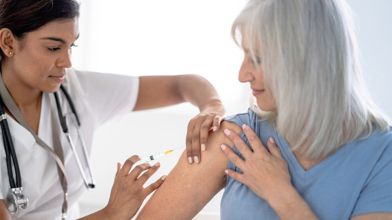 woman getting vaccine