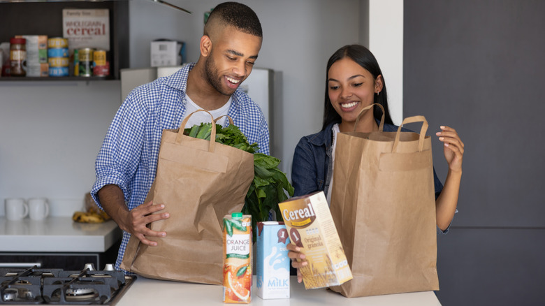 Couple unpacking their groceries