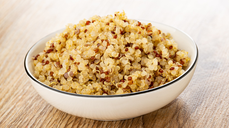 Cooked quinoa in white bowl